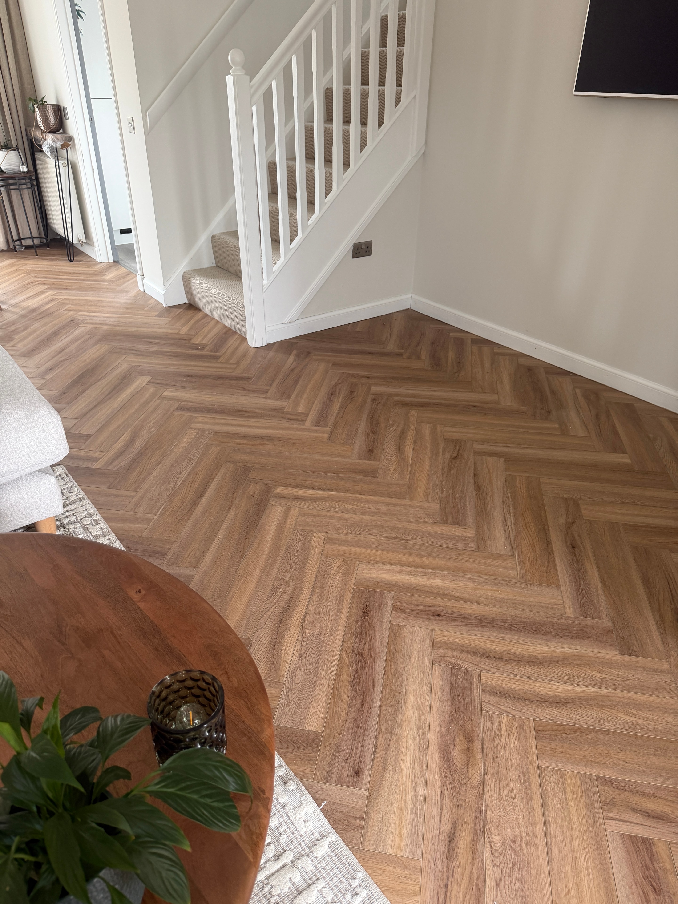 Living room with herringbone LVT flooring